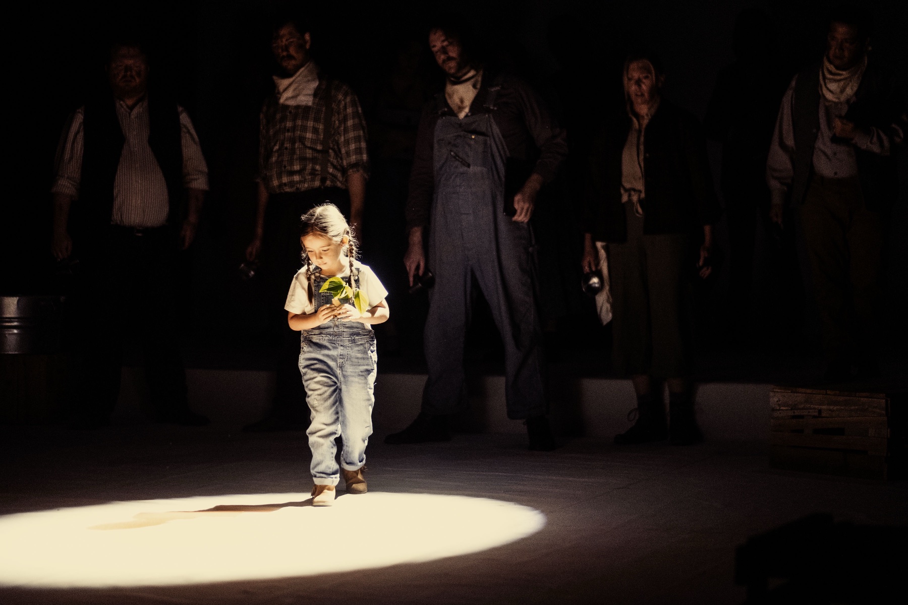 Child performer in a spotlight during Dust Bowl