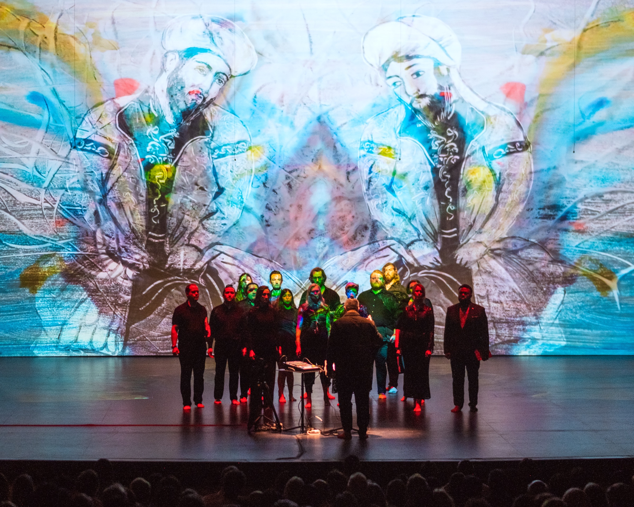 Verdigris Ensemble performing SHAMS in front of Sara Baumann's projected visual art